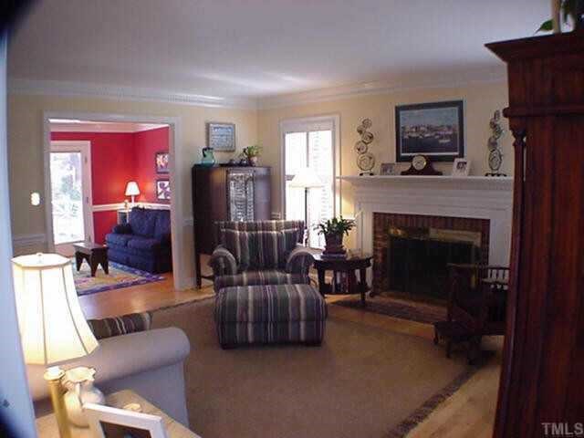 8804 Wellsley Way Raleigh, NC 27613 - Photo 3 of 10 a living room with furniture and a fireplace