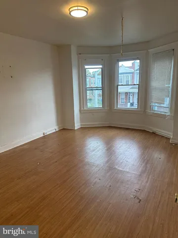 a view of gallery with wooden floor