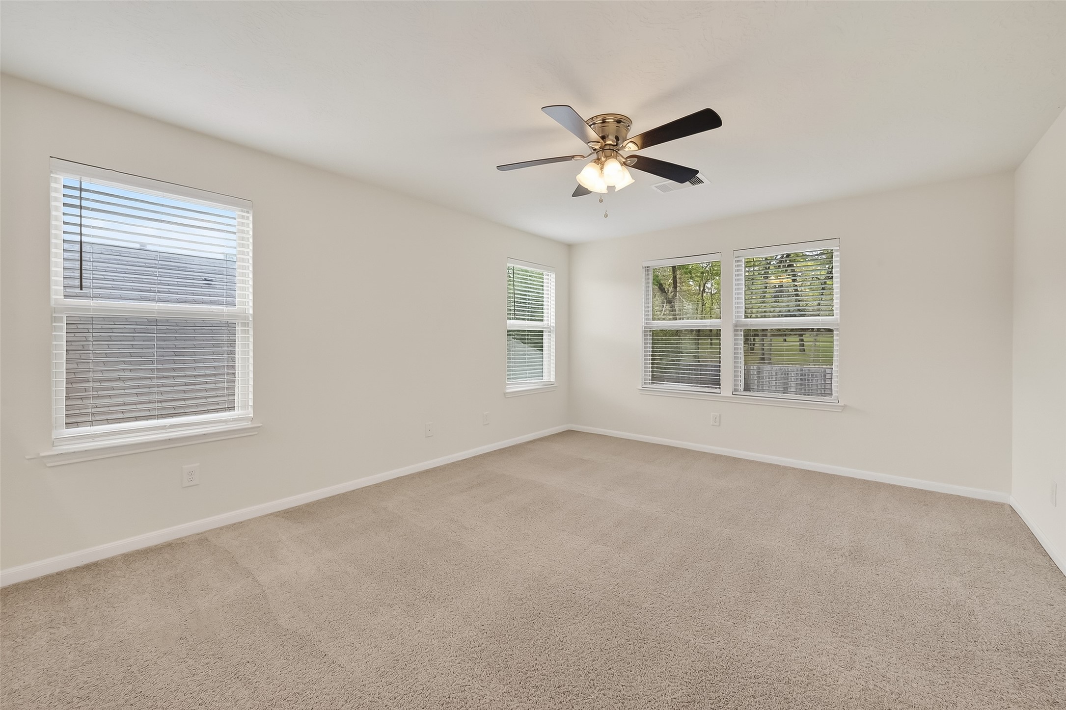 2107 Parnevik Place Conroe, TX 77304 - Photo 19 of 44 5 windows to look out on beautiful Conroe, or to let Conroe's beautiful light in! I wonder, Have you noticed yet that there doesn't seem to be a back neighbor?