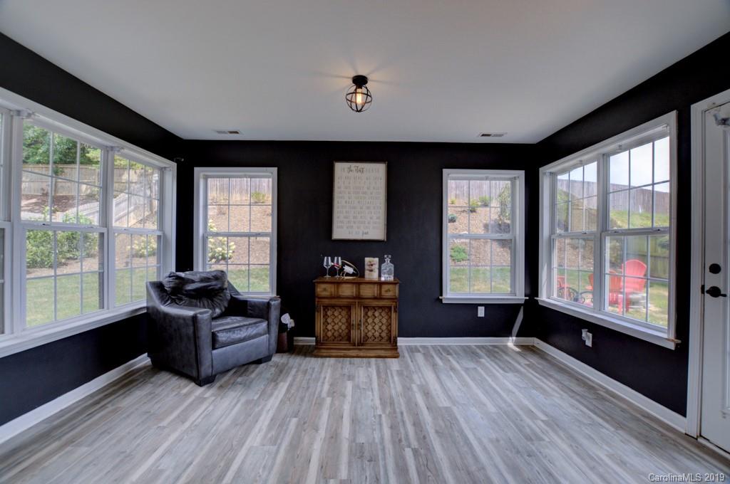 87 Yadkin Road Fletcher, NC 28732 - Photo 16 of 34 a living room with furniture and large windows