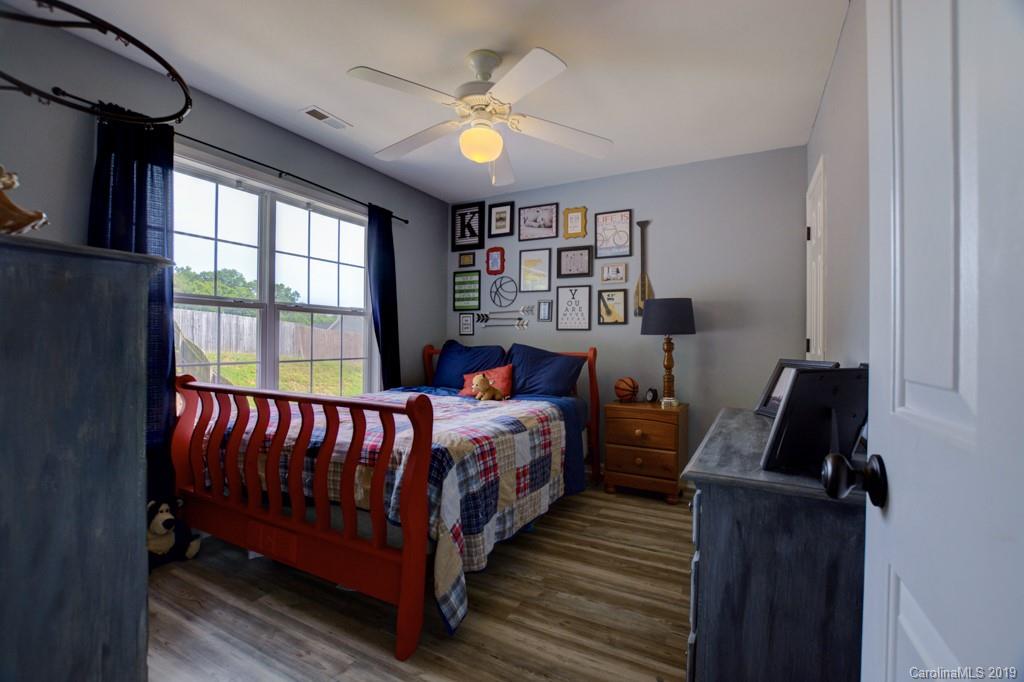 87 Yadkin Road Fletcher, NC 28732 - Photo 32 of 34 a bed room with a bed and a window