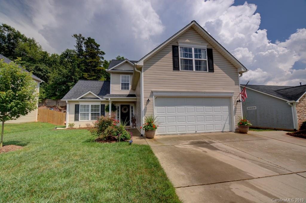 87 Yadkin Road Fletcher, NC 28732 - Photo 34 of 34 a front view of house with yard and trees in the background