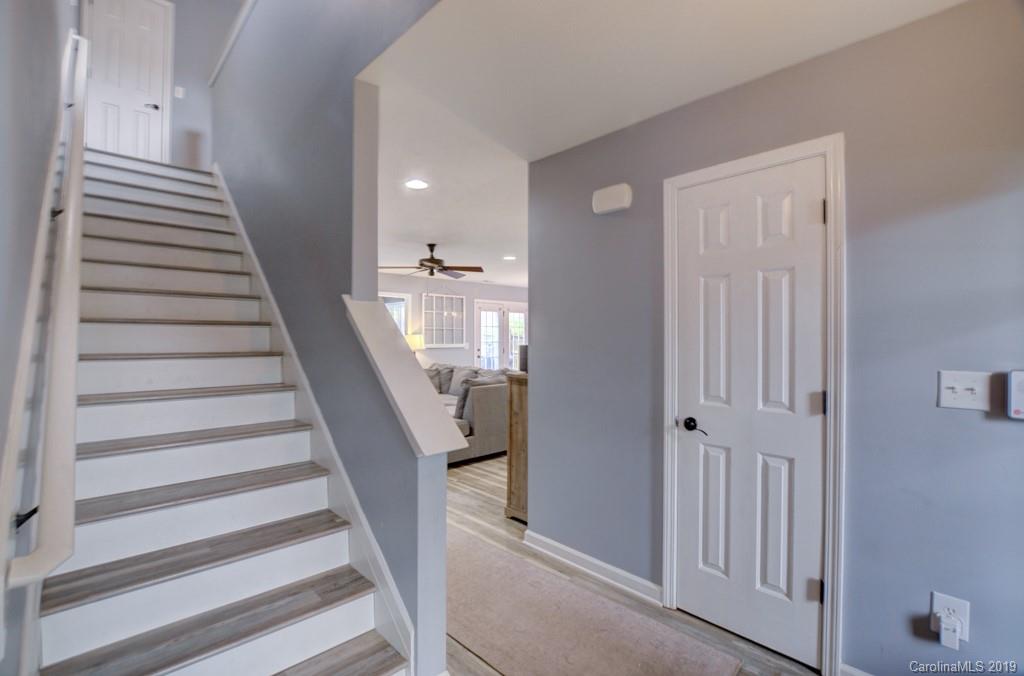 87 Yadkin Road Fletcher, NC 28732 - Photo 10 of 34 a view of entryway with wooden floor and windows