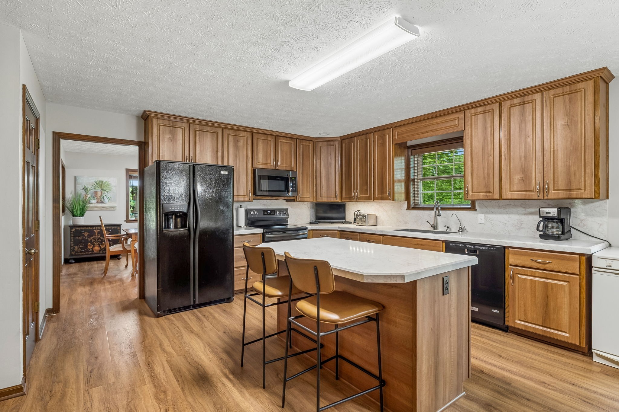 20 Riverbend Lane Carthage, TN 37030 - Photo 19 of 71 a kitchen with stainless steel appliances granite countertop a stove a refrigerator a sink a stove and island with wooden floor