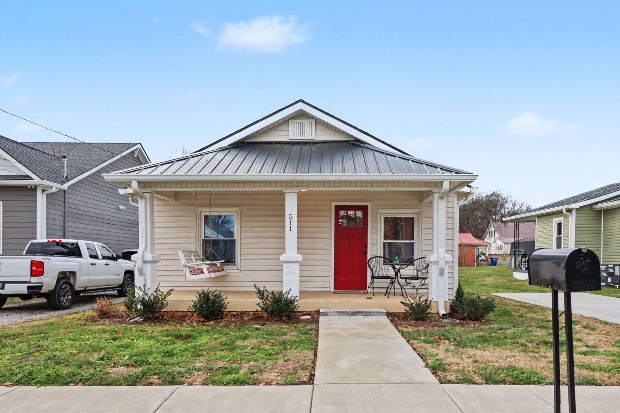 a front view of house with yard and green space