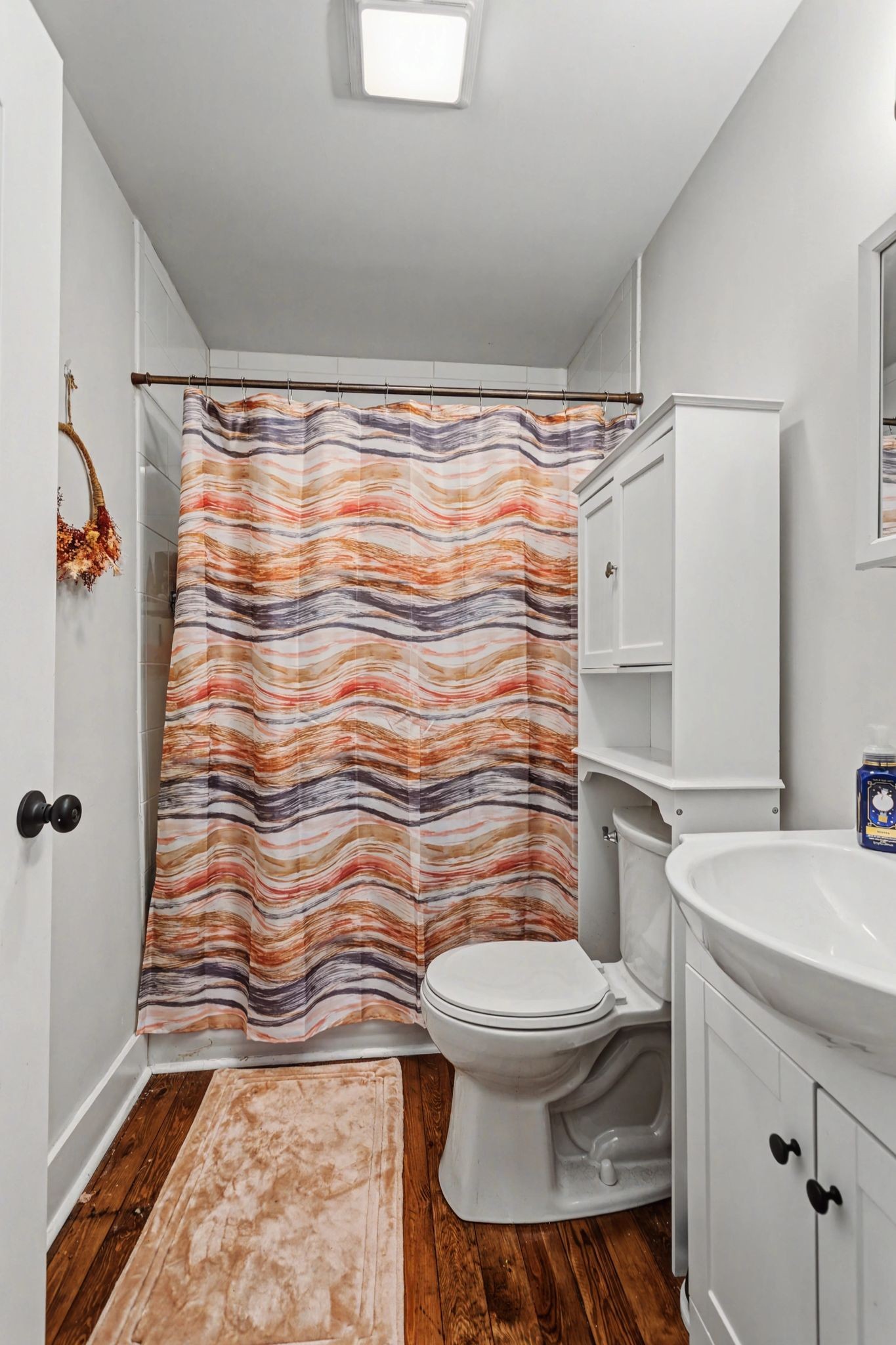 511 Florida Avenue Mount Pleasant, TN 38474 - Photo 16 of 28 a bathroom with a sink toilet and shower