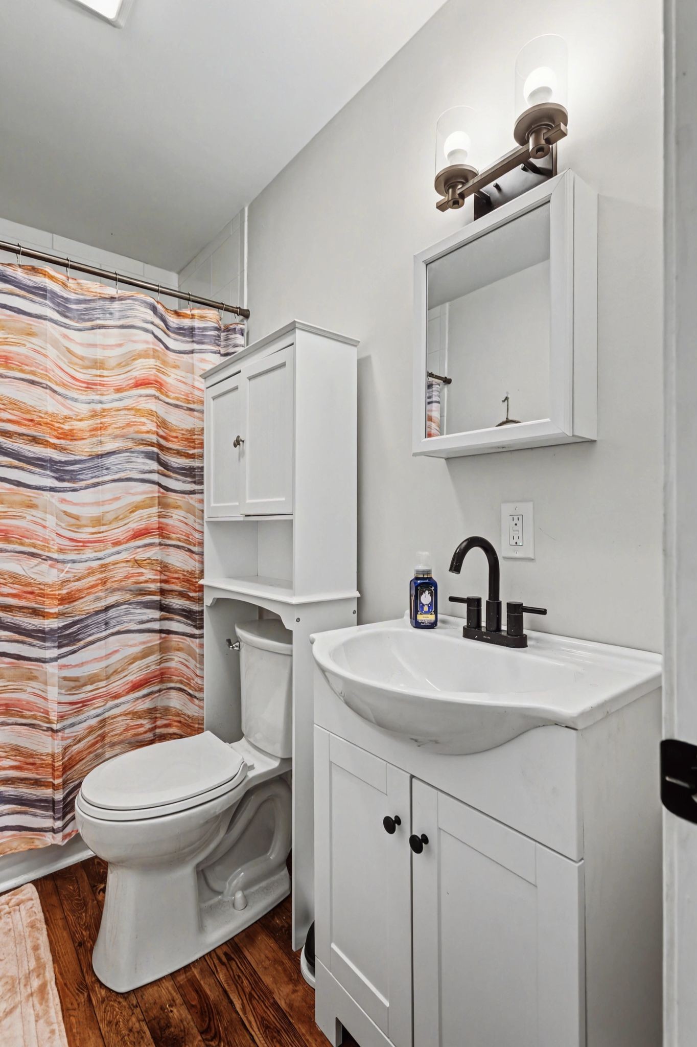 511 Florida Avenue Mount Pleasant, TN 38474 - Photo 17 of 28 a bathroom with a sink toilet and shower