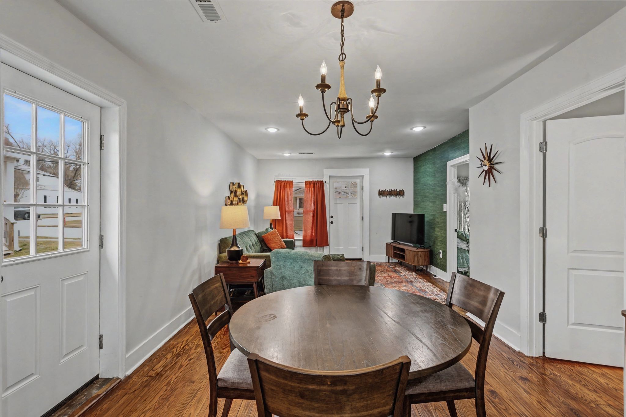 511 Florida Avenue Mount Pleasant, TN 38474 - Photo 9 of 28 a view of a dining room with furniture wooden floor and chandelier