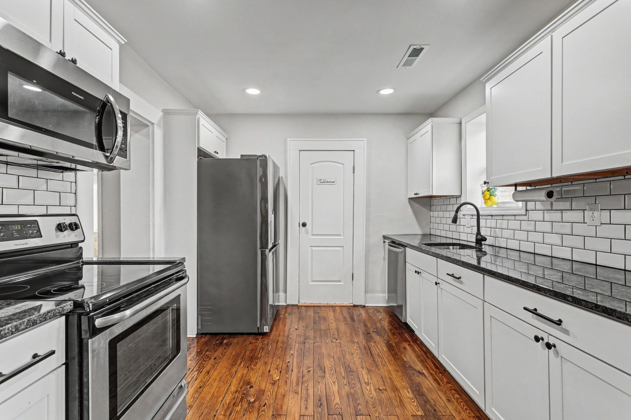 511 Florida Avenue Mount Pleasant, TN 38474 - Photo 10 of 28 a kitchen with stainless steel appliances a refrigerator sink and microwave