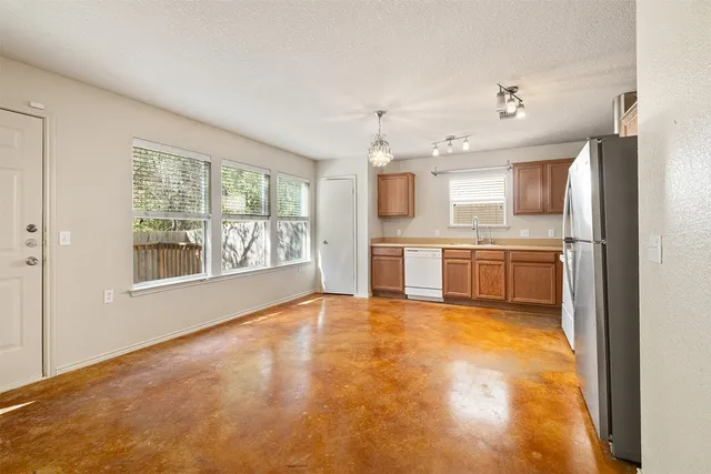 a view of a kitchen with a sink cabinets and a window