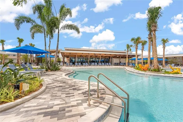 a view of a swimming pool with a patio
