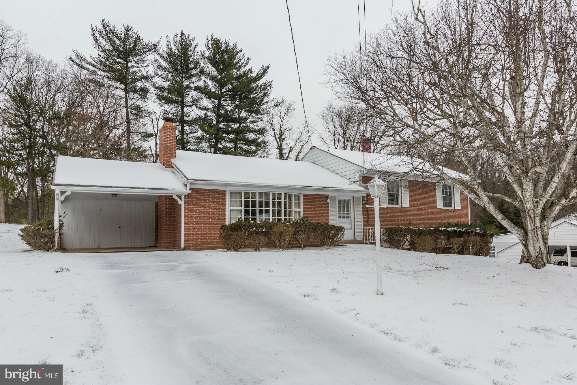 a view of a house with a snow in front of house