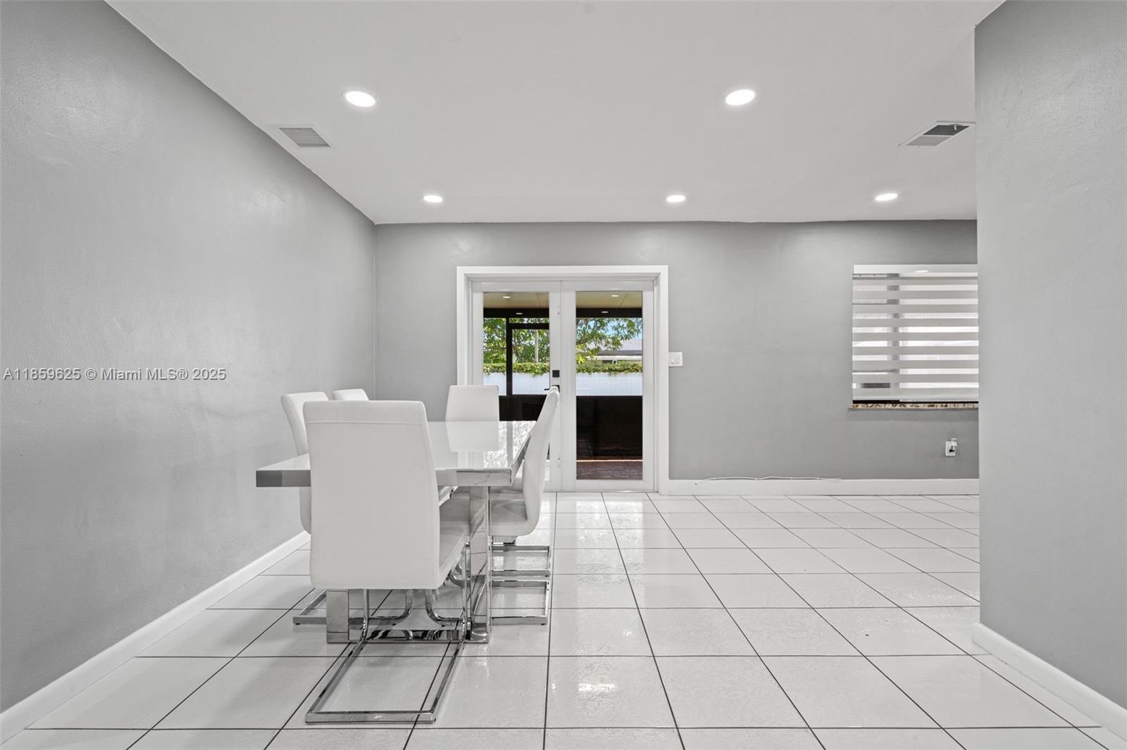 10450 Southwest 43rd Street Miami, FL 33165 - Photo 11 of 43 a view of a dining room with a table and chairs