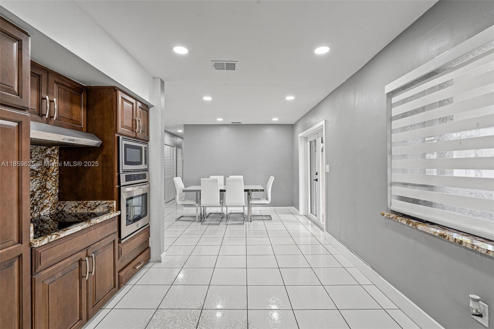 10450 Southwest 43rd Street Miami, FL 33165 - Photo 16 of 43 a bathroom with a sink and a mirror