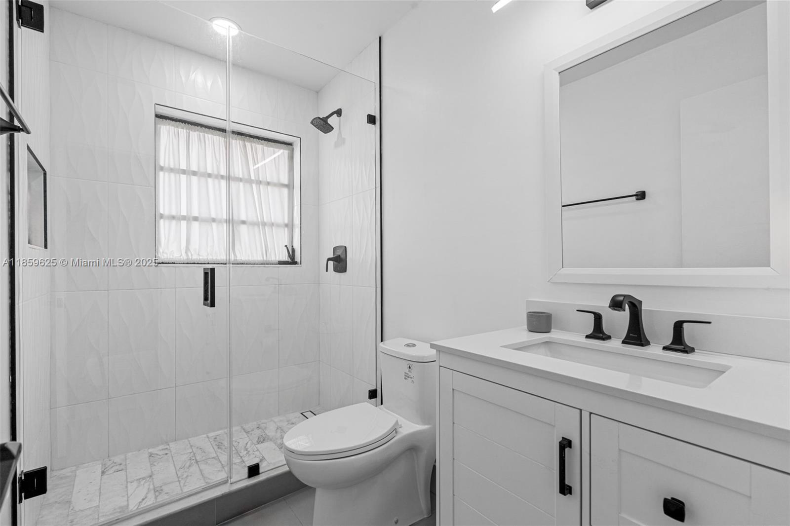 10450 Southwest 43rd Street Miami, FL 33165 - Photo 24 of 43 a bathroom with a sink toilet and shower
