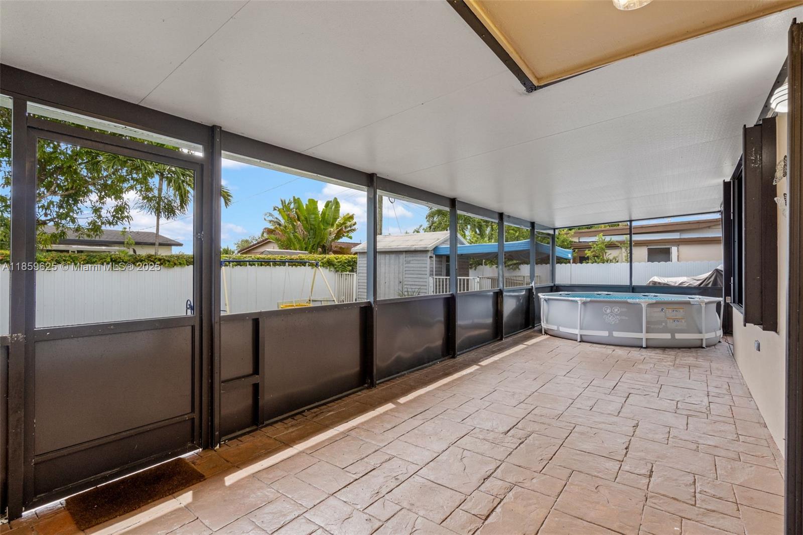 10450 Southwest 43rd Street Miami, FL 33165 - Photo 27 of 43 a view of a living room with a large window