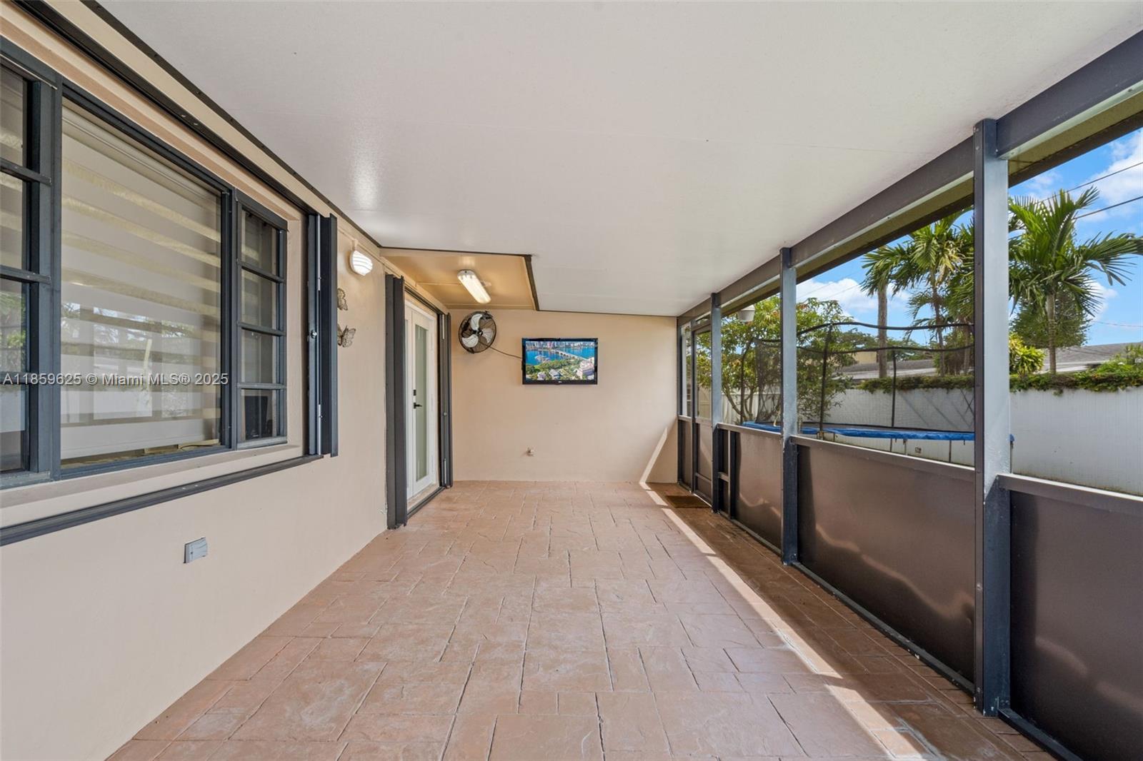 10450 Southwest 43rd Street Miami, FL 33165 - Photo 29 of 43 a view of hallway with a large window