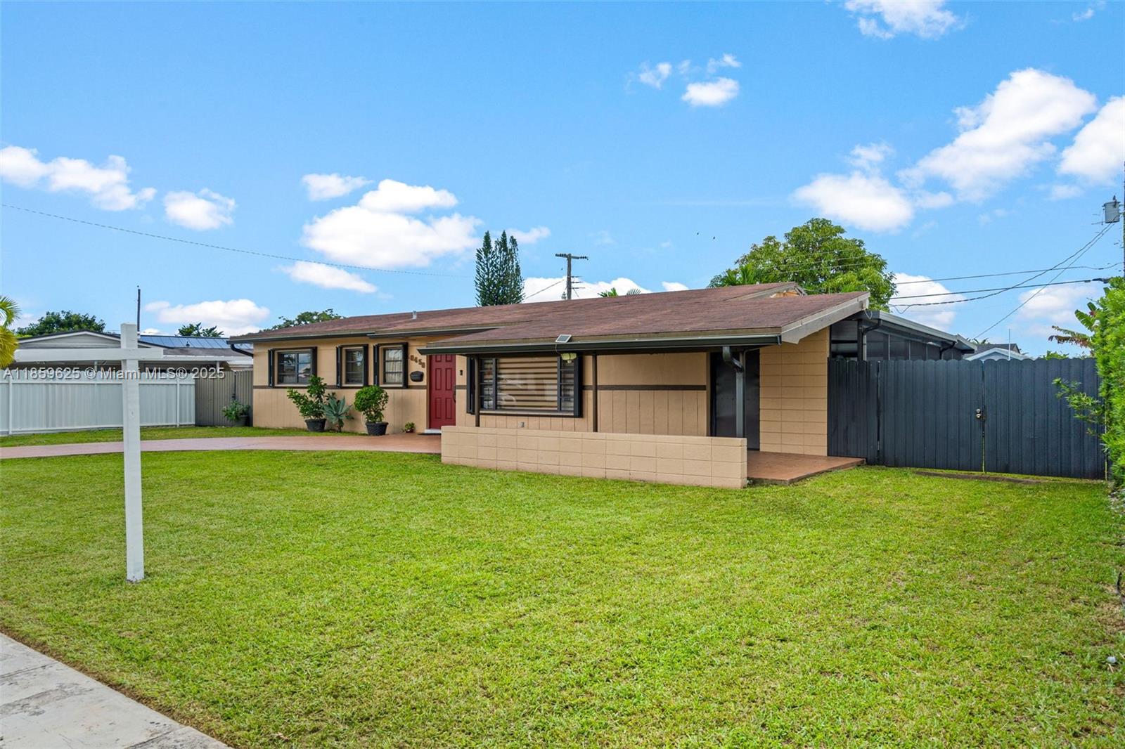 10450 Southwest 43rd Street Miami, FL 33165 - Photo 3 of 43 a view of a house with a yard and a patio