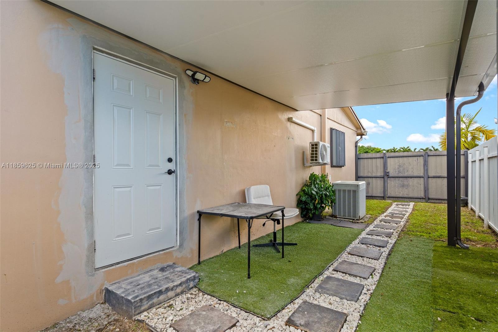 10450 Southwest 43rd Street Miami, FL 33165 - Photo 32 of 43 a view of a backyard with sitting area