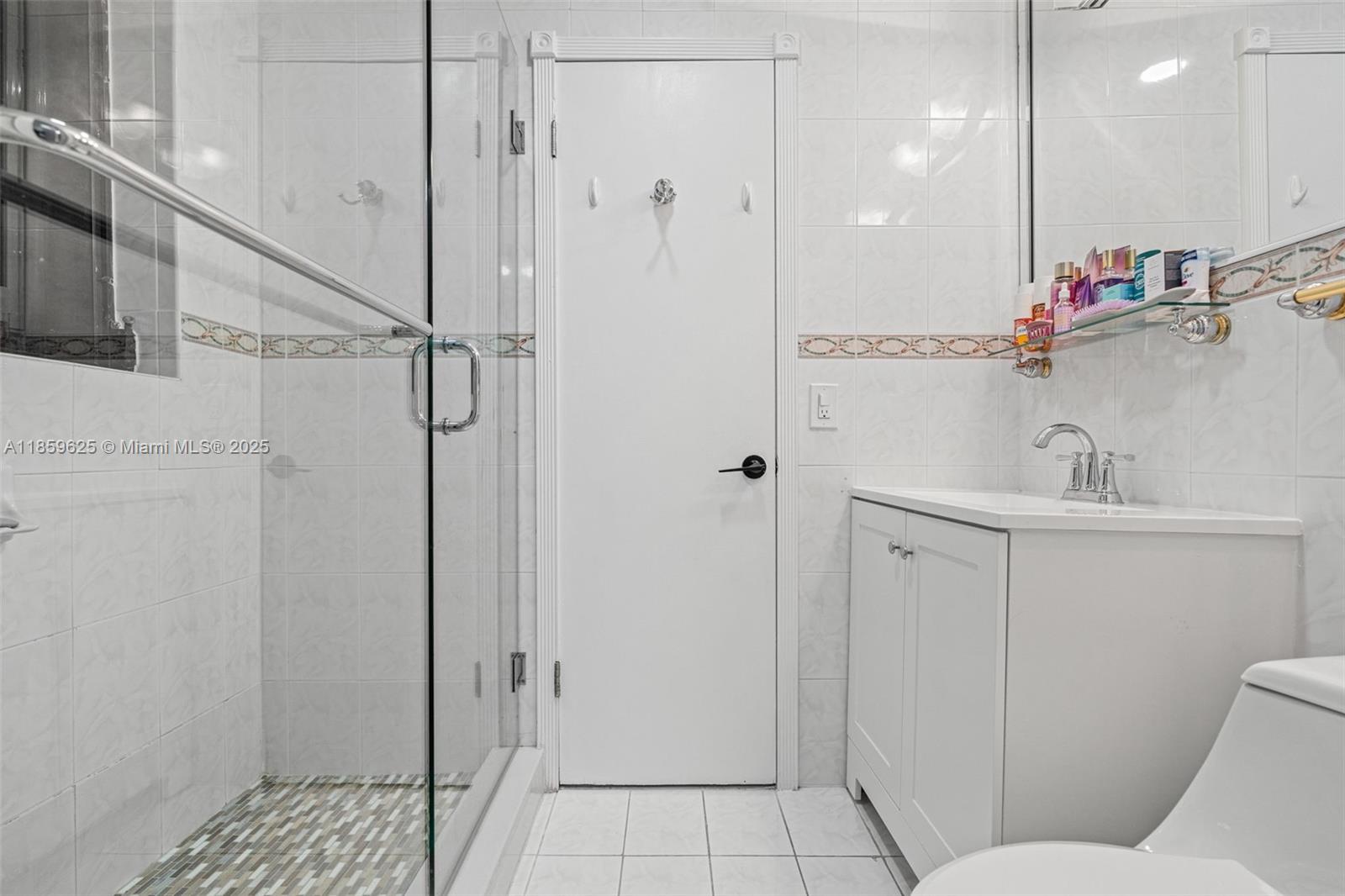 10450 Southwest 43rd Street Miami, FL 33165 - Photo 35 of 43 a bathroom with a sink a toilet and shower