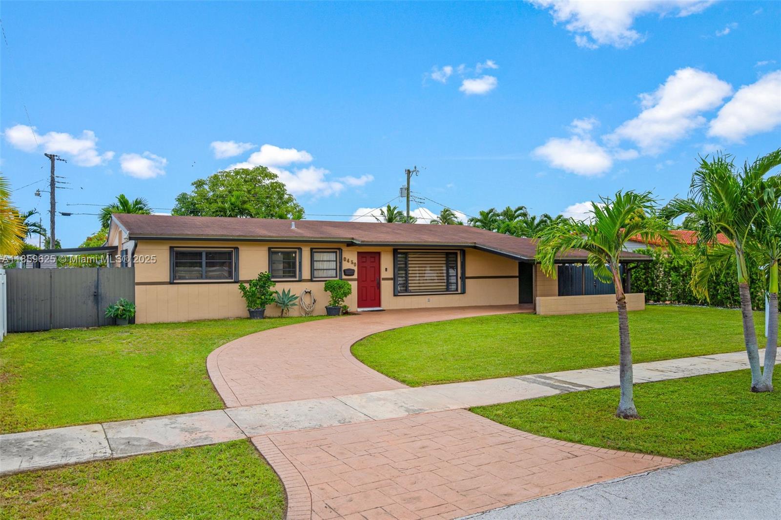 10450 Southwest 43rd Street Miami, FL 33165 - Photo 5 of 43 a front view of a house with garden