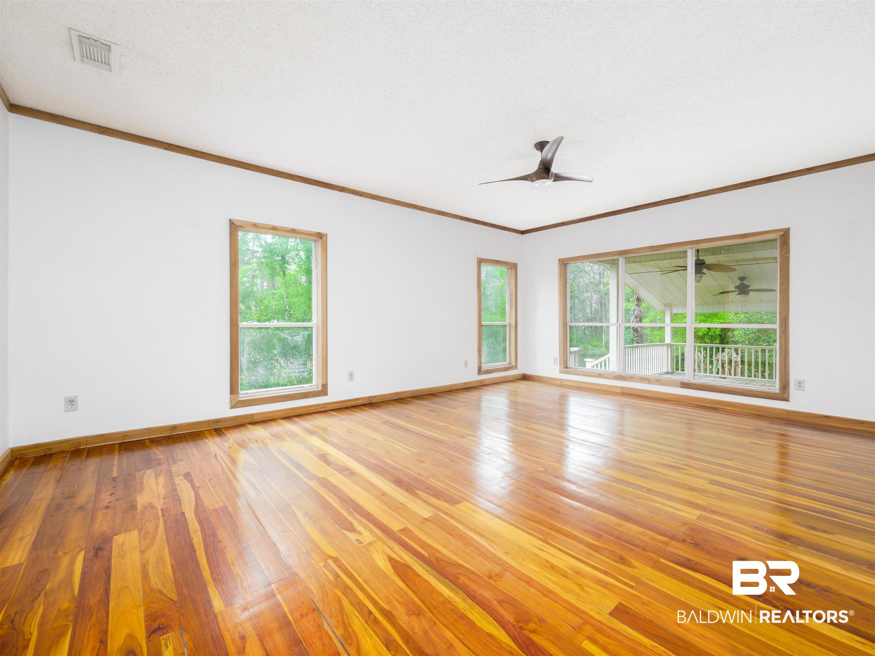 12831 Clay City Road Fairhope, AL 36532 - Photo 14 of 47 Oversized with teak flooring and overlooks river