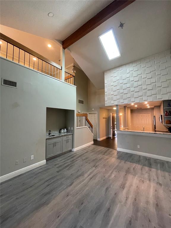 7652 Spring Bay Cove, Unit 3 Orlando, FL 32819 - Photo 12 of 30 a view of empty room with wooden floor and fireplace