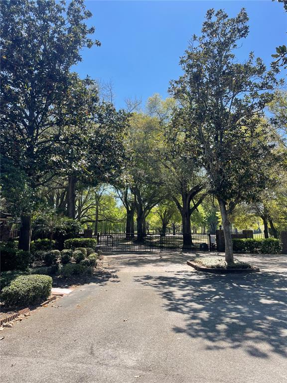 7652 Spring Bay Cove, Unit 3 Orlando, FL 32819 - Photo 2 of 30 a view of street with trees