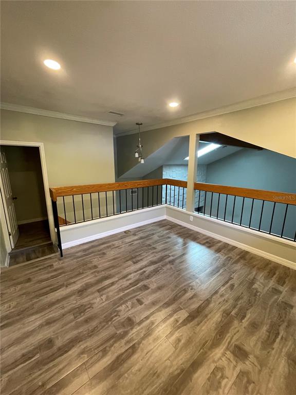 7652 Spring Bay Cove, Unit 3 Orlando, FL 32819 - Photo 24 of 30 a view of hallway with wooden floor