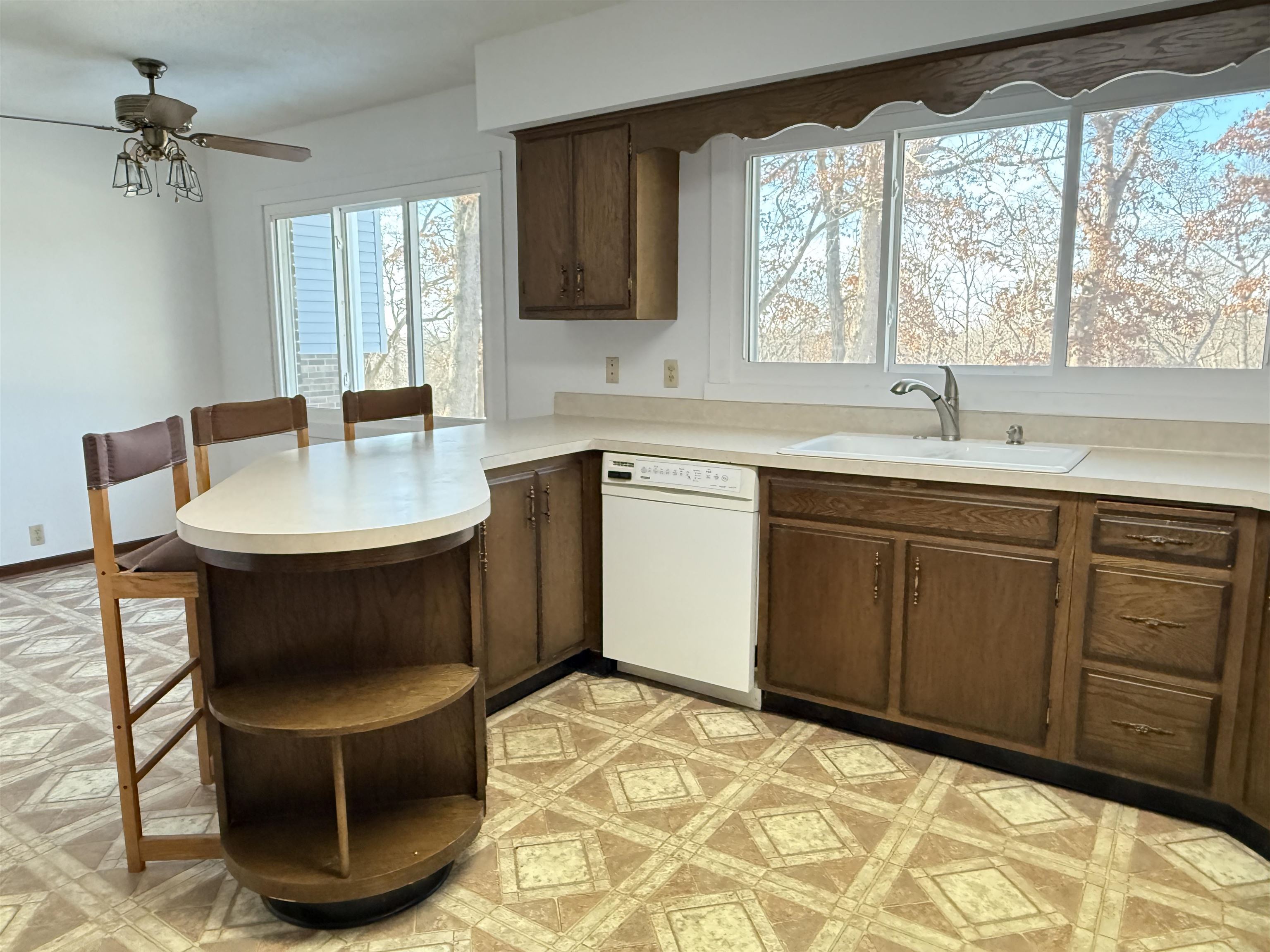 45 South Blackhawk Road Oregon, IL 61061 - Photo 12 of 42 a kitchen with a sink cabinets and window