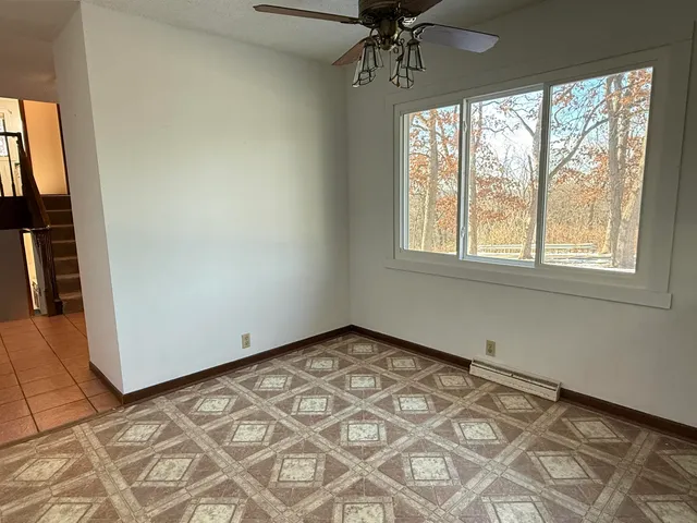 a view of an empty room with a large window
