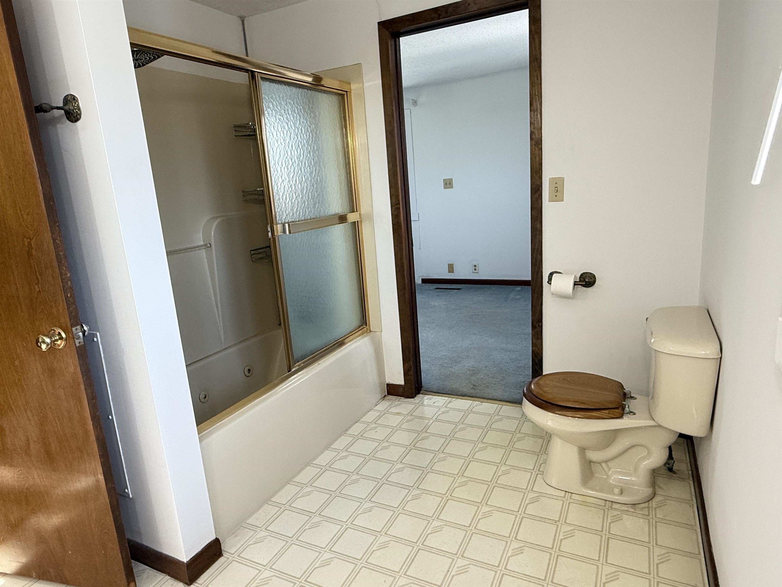 45 South Blackhawk Road Oregon, IL 61061 - Photo 17 of 42 a bathroom with a granite countertop toilet and a shower