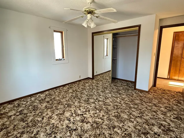 a view of a yard with snow on the road