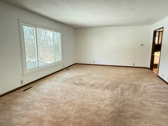 a kitchen with a sink cabinets and appliances