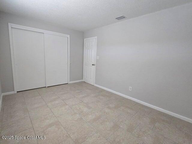 417 Audubon Drive, Unit B Melbourne, FL 32901 - Photo 11 of 12 a view of an empty room