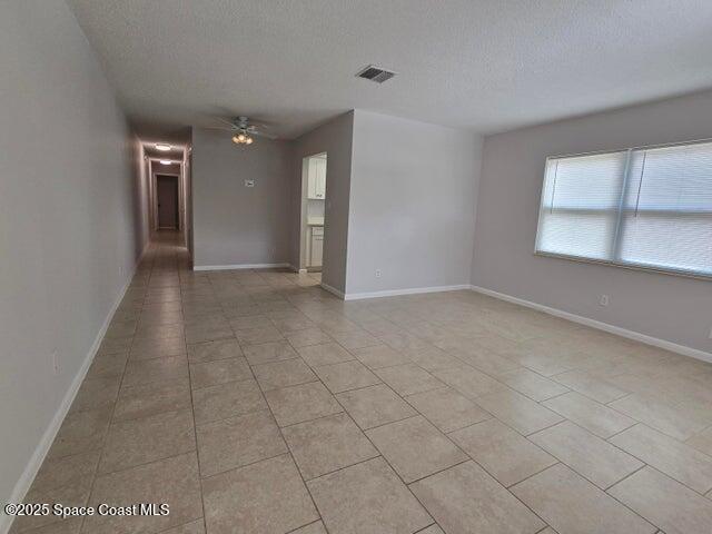 417 Audubon Drive, Unit B Melbourne, FL 32901 - Photo 3 of 12 wooden floor in an empty room with a window