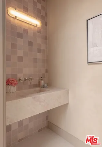 a kitchen with sink cabinets dining table and chairs