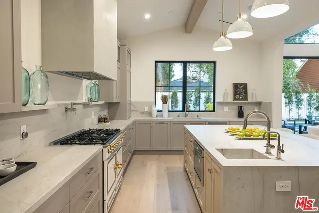 a spacious bedroom with a large bed and a large window with outer view