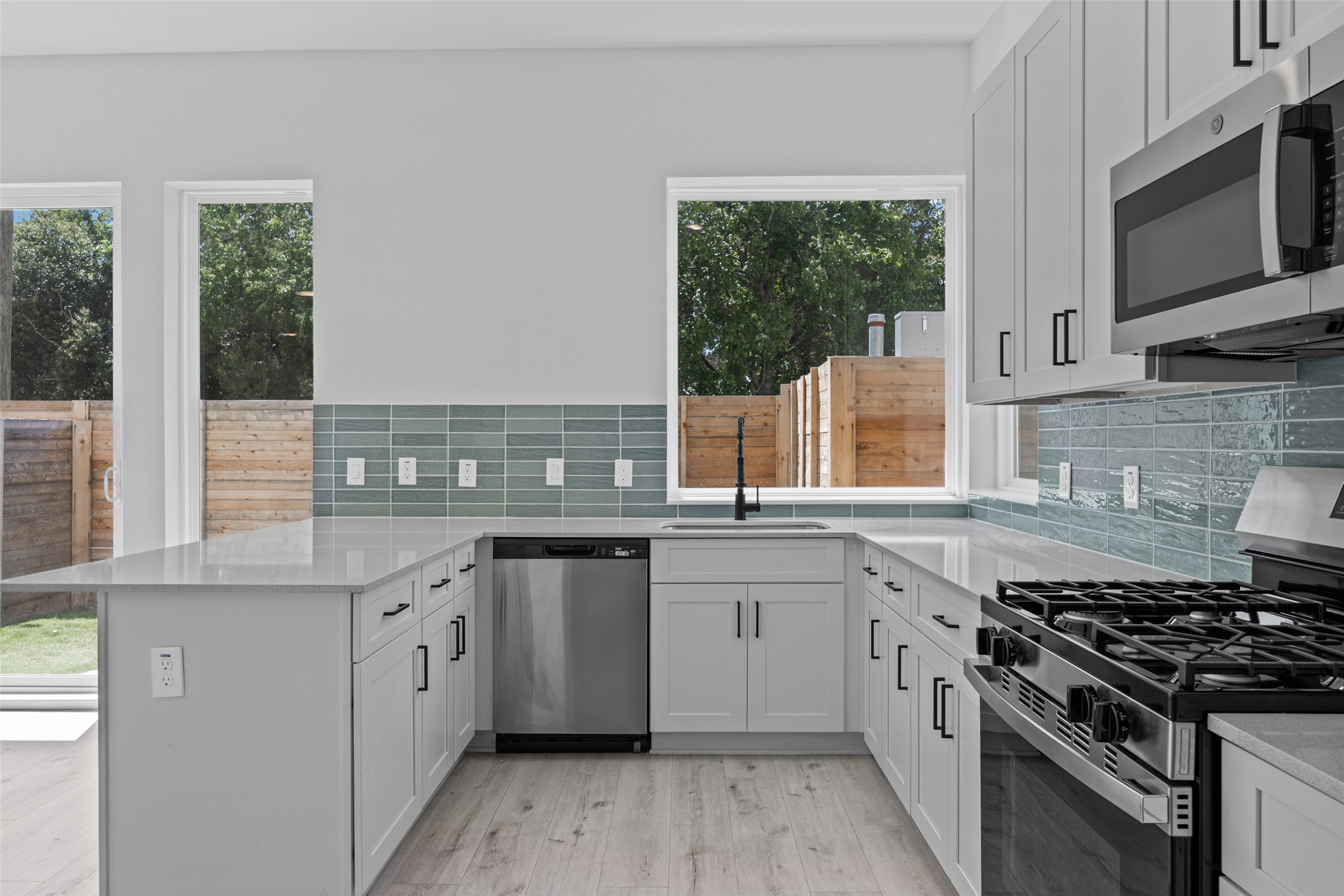 2000 Riverside Farms Road, Unit 5102 Austin, TX 78741 - Photo 4 of 25 A well-appointed kitchen features stainless steel appliances, ample counter space, and luminous windows.