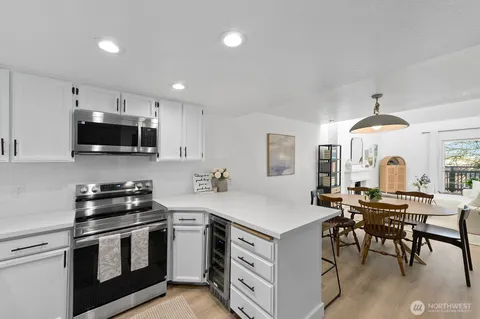 a kitchen with granite countertop a stove and a sink