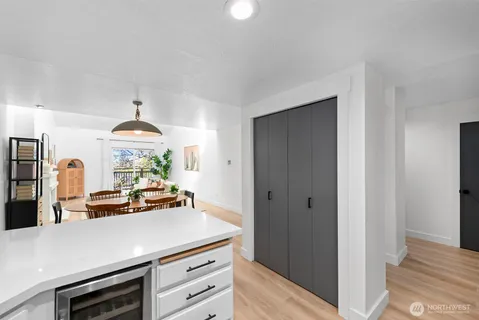 a view of kitchen with sink stove and refrigerator