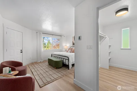 a bedroom with furniture and a window