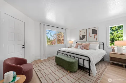 a bedroom with a bed and a couch