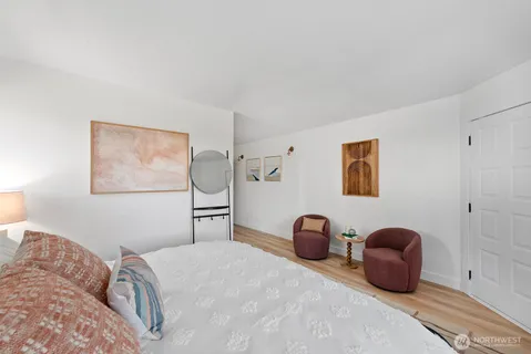 a bedroom with a bed and a table