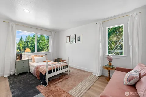 a bedroom with a bed and window