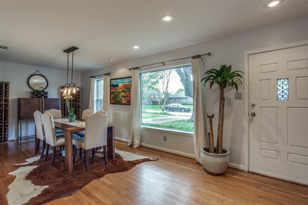 6450 Ridgemont Drive Dallas, TX 75214 - Photo 1 of 1 a view of a dining room with furniture window and wooden floor