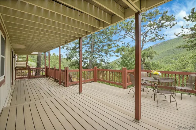 a view of a balcony with wooden floor