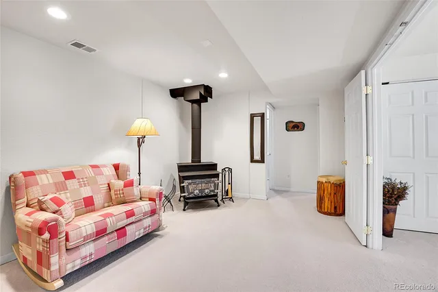 a bedroom with furniture and a potted plant