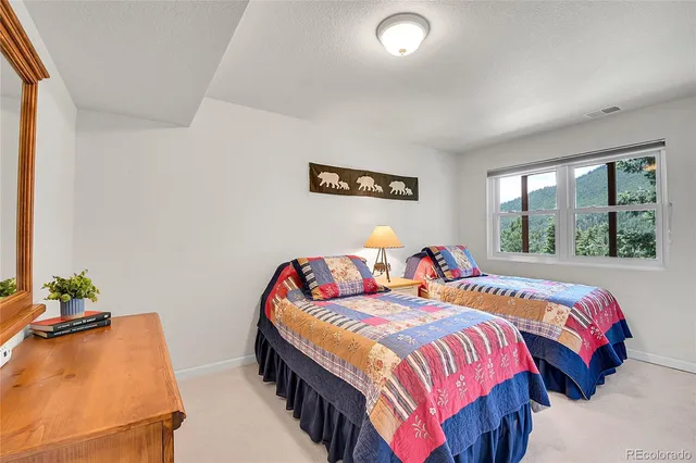 a bedroom with bed and a window