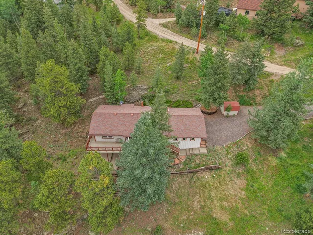 an aerial view of a house with yard and outdoor space